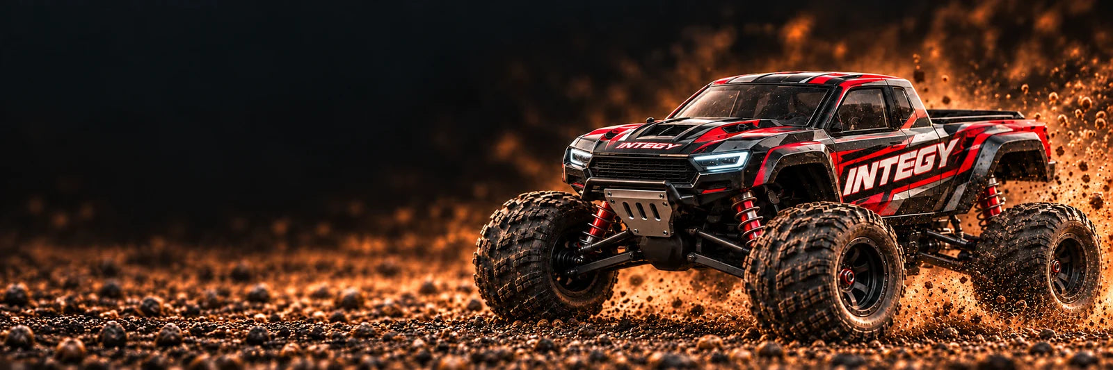 INTEGY-branded RC monster truck artwork on a gravel track