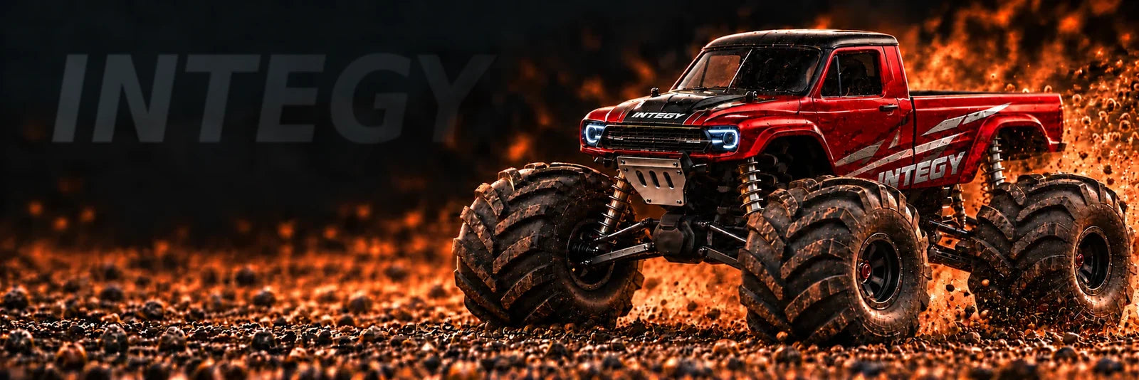 Red RC monster pickup with silver INTEGY body graphics, raised suspension and oversized tires on a gravel track